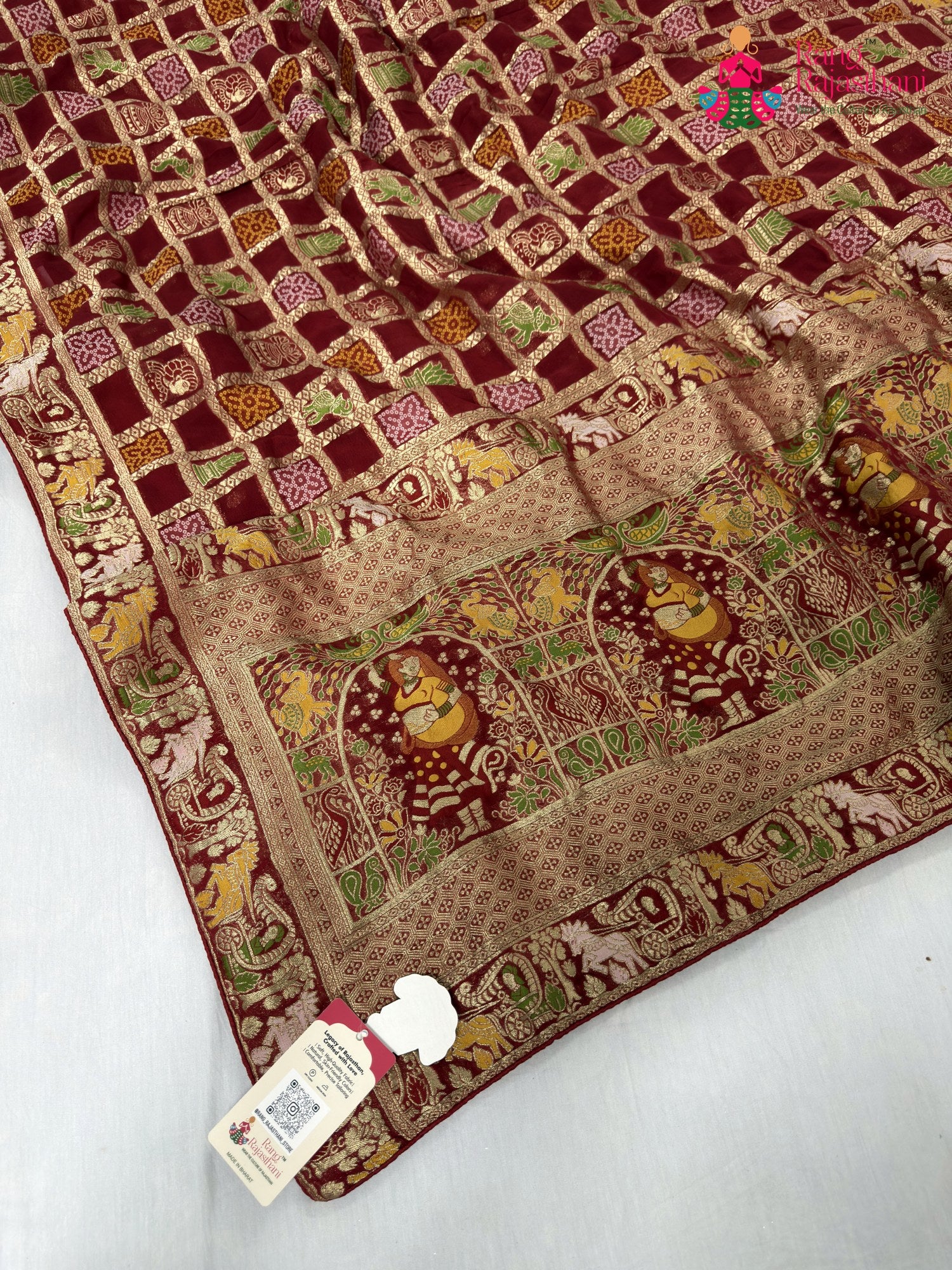 pallu detailing of red soft georgette bandhani saree