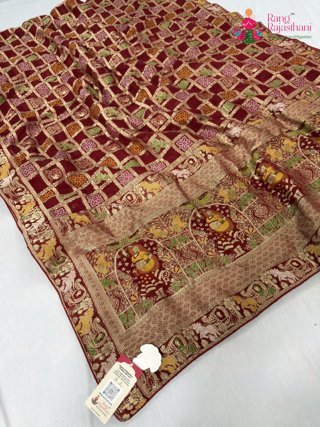 close up detailing of red soft georgette bandhani saree