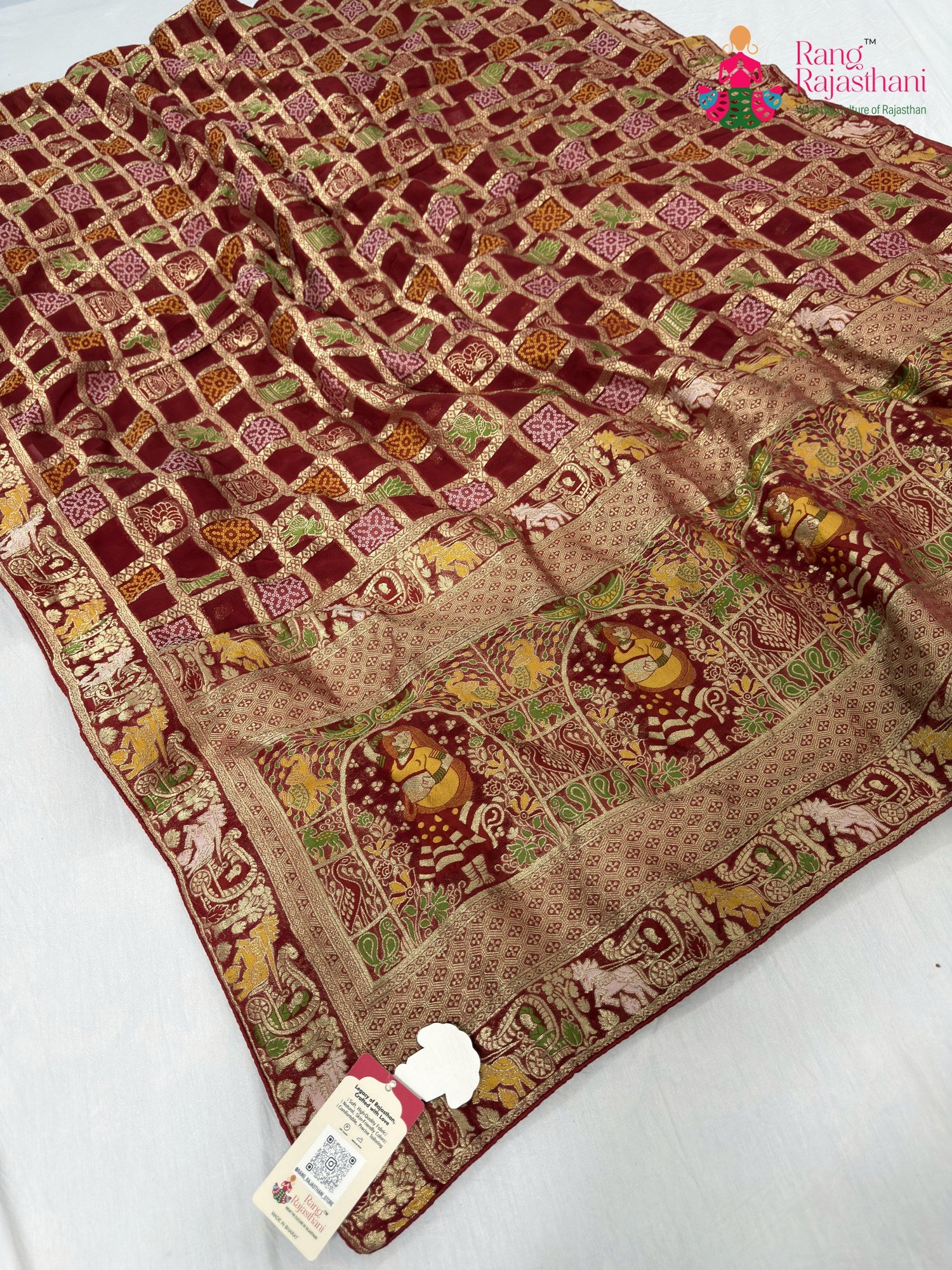 close up detailing of red soft georgette bandhani saree