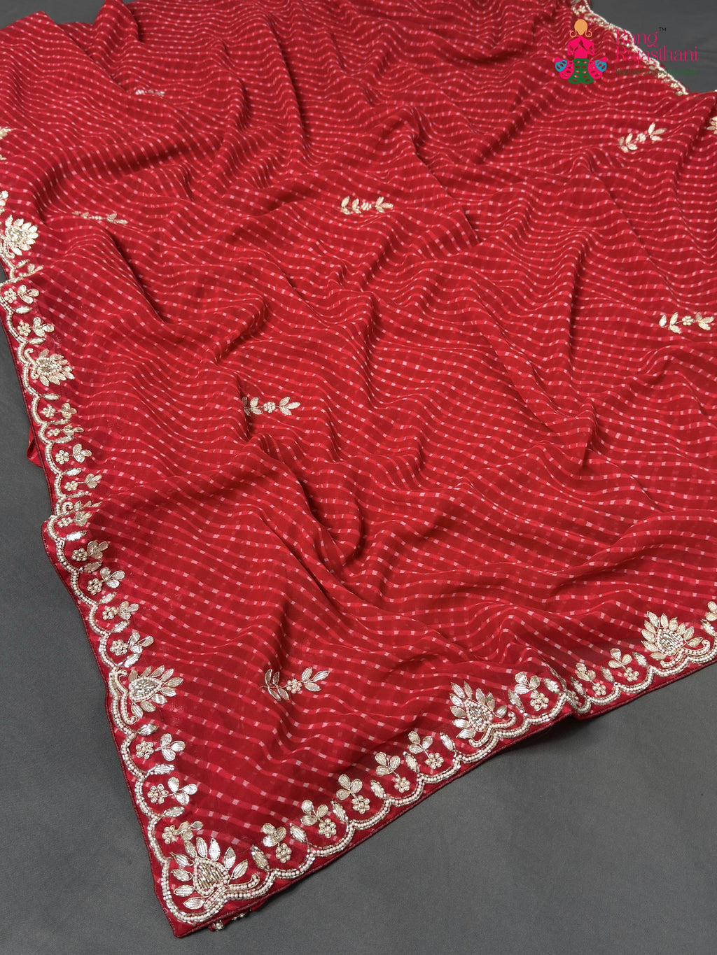 pallu detailing of red soft georgette gota patti saree