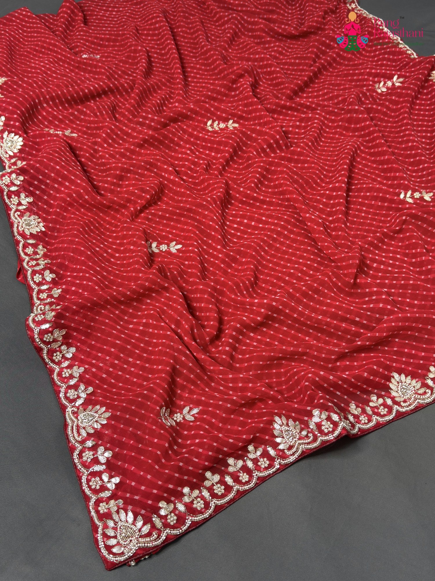 pallu detailing of red soft georgette gota patti saree