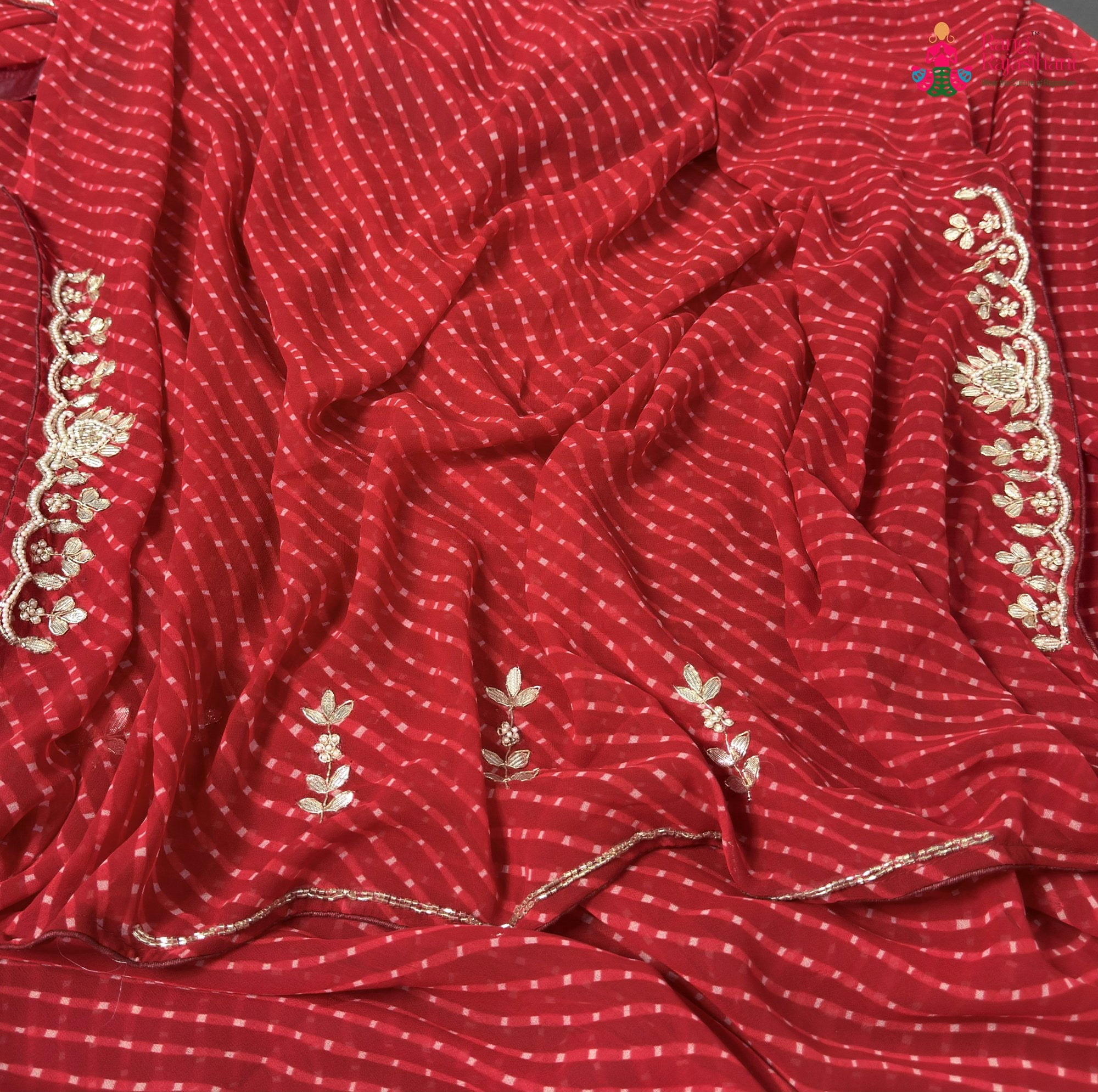 border detailing of red soft georgette gota patti saree