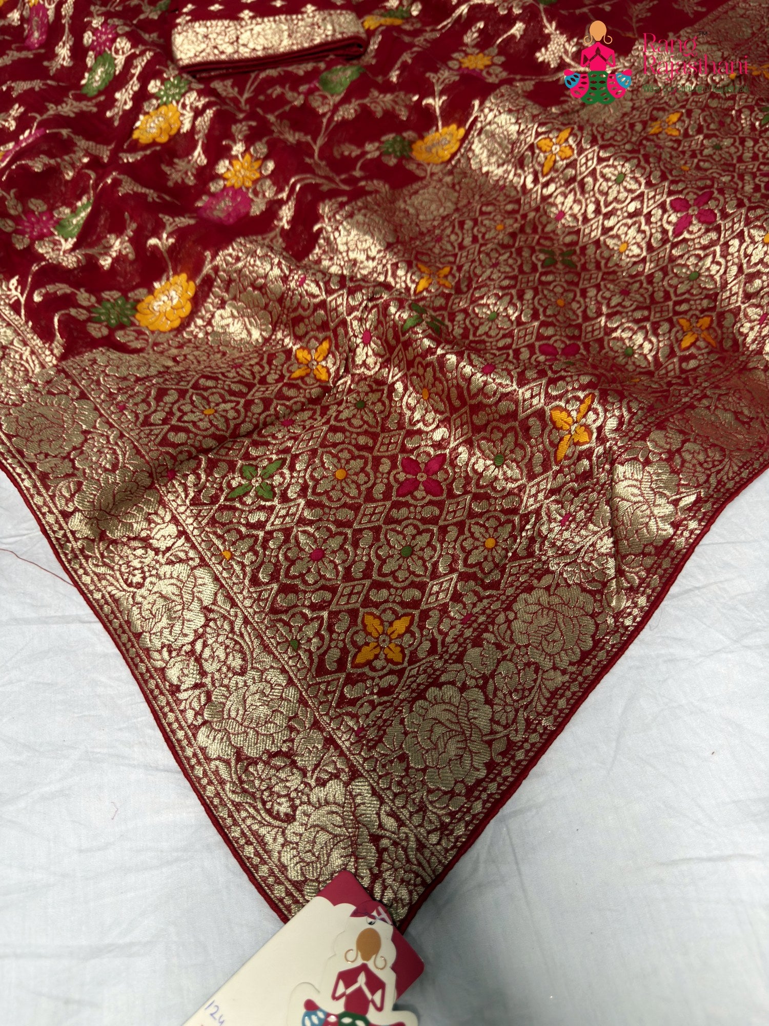 pallu detailing of red soft georgette meenakari zari saree