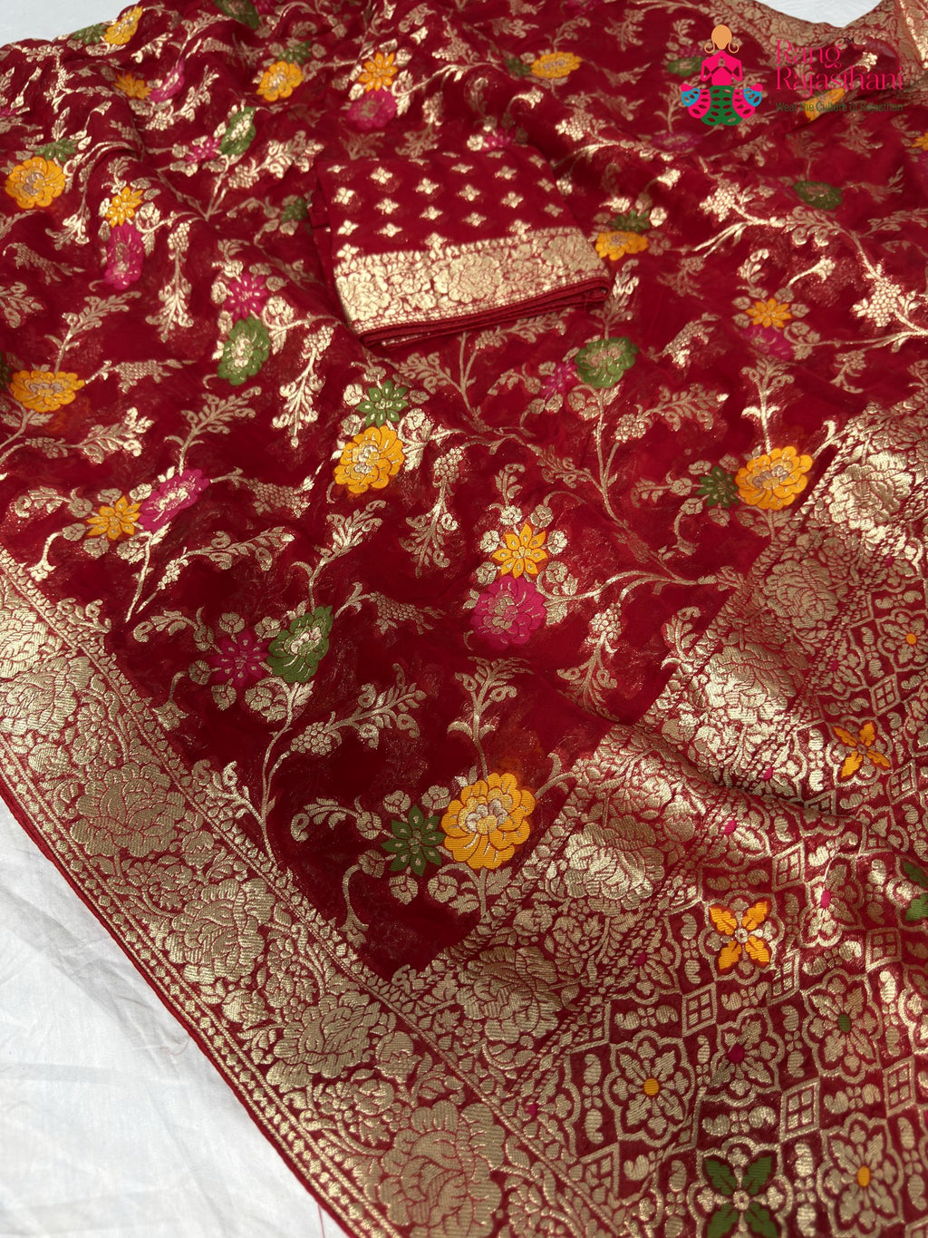 close up detailing of red soft georgette meenakari zari saree