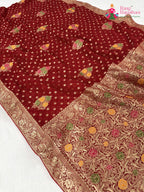 pallu detailing of red soft georgette meenakari zari saree