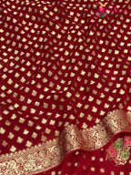 close up view of red soft georgette meenakari zari saree