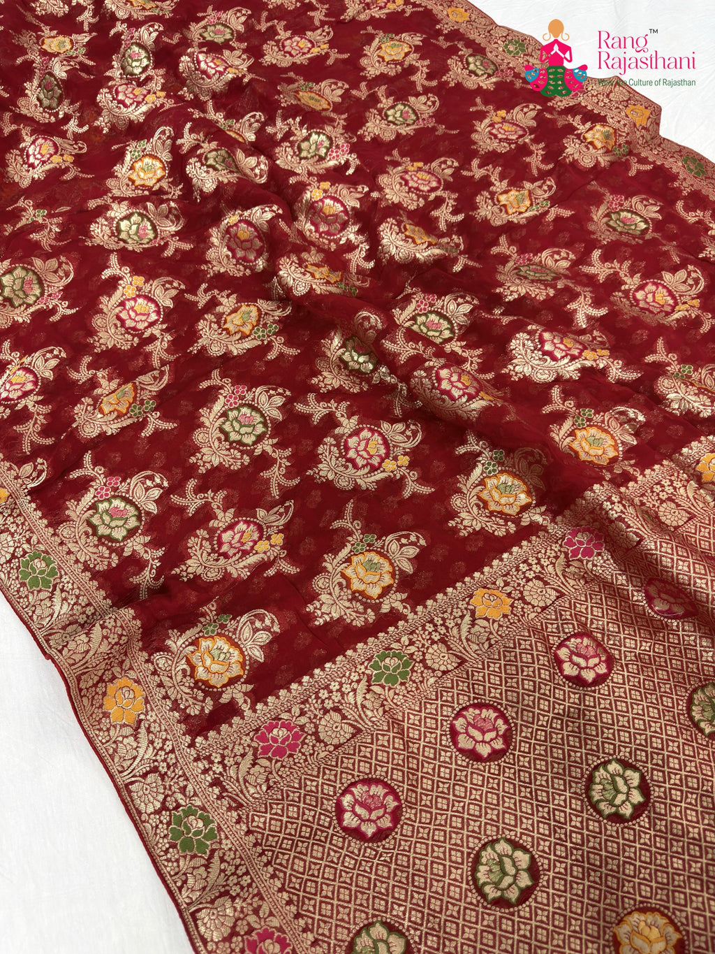 pallu detailing of red soft georgette meenakari zari saree