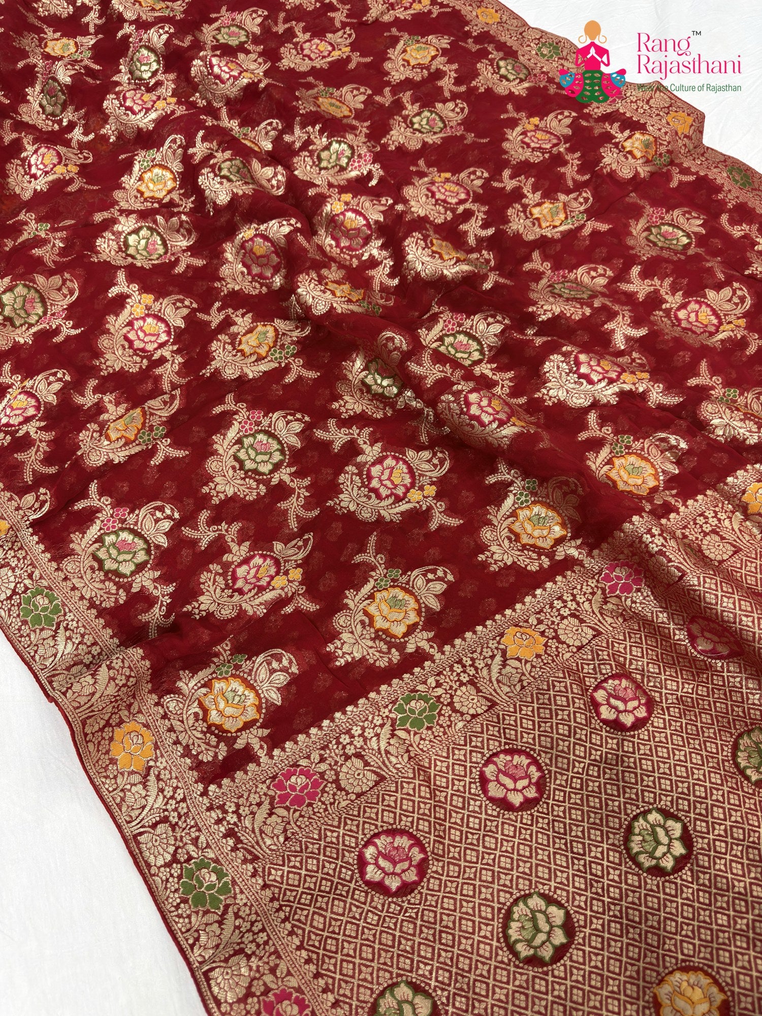 pallu detailing of red soft georgette meenakari zari saree
