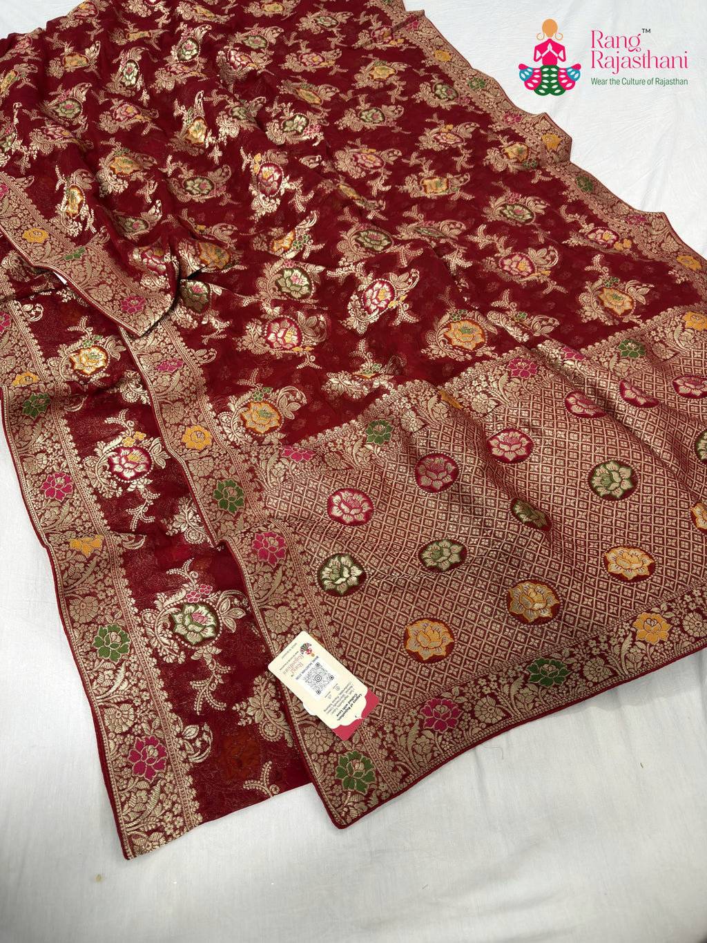 close up detailing of red soft georgette meenakari zari saree