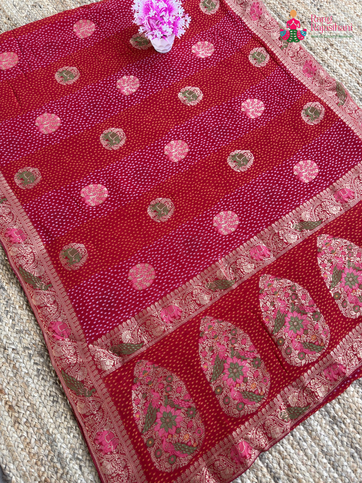 pallu detailing of red soft georgette meenakari zari saree