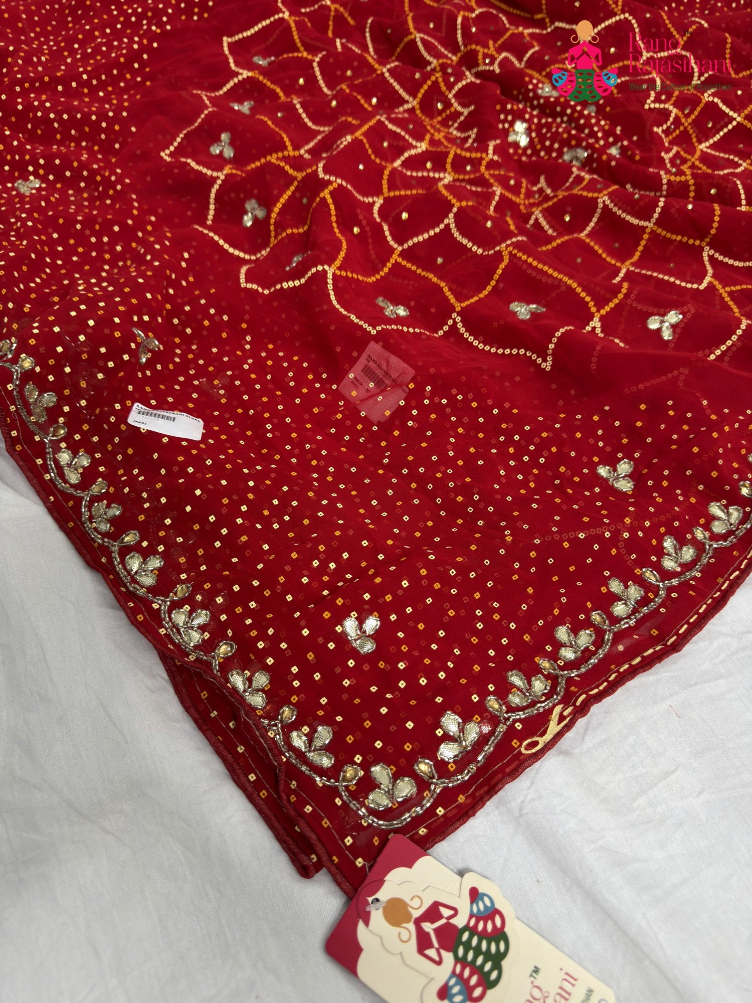 border detailing of red synthetic bandhani saree