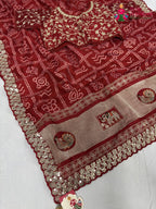 pallu detailing of red synthetic zari embroidery saree