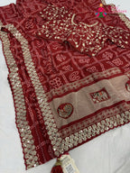 complete look of red synthetic zari embroidery saree