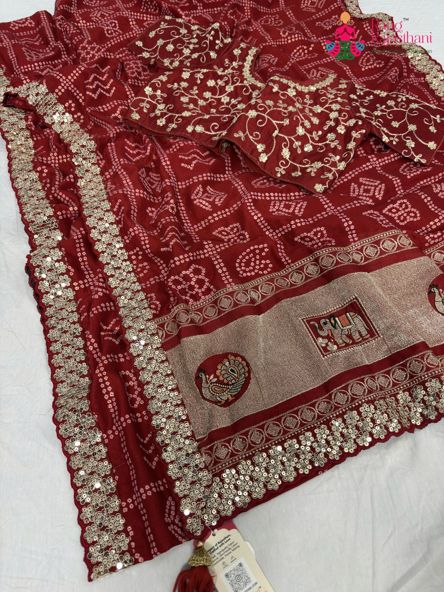 complete look of red synthetic zari embroidery saree