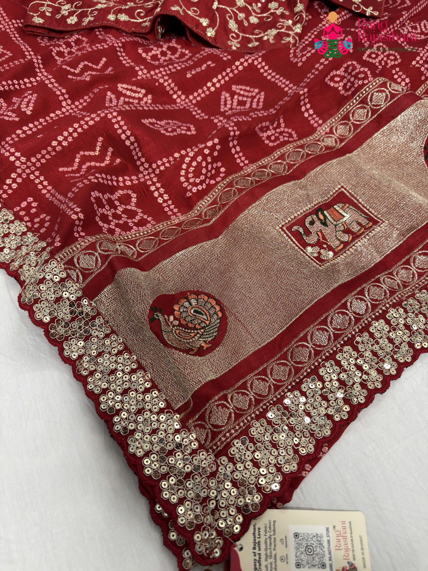 border detailing of red synthetic zari embroidery saree