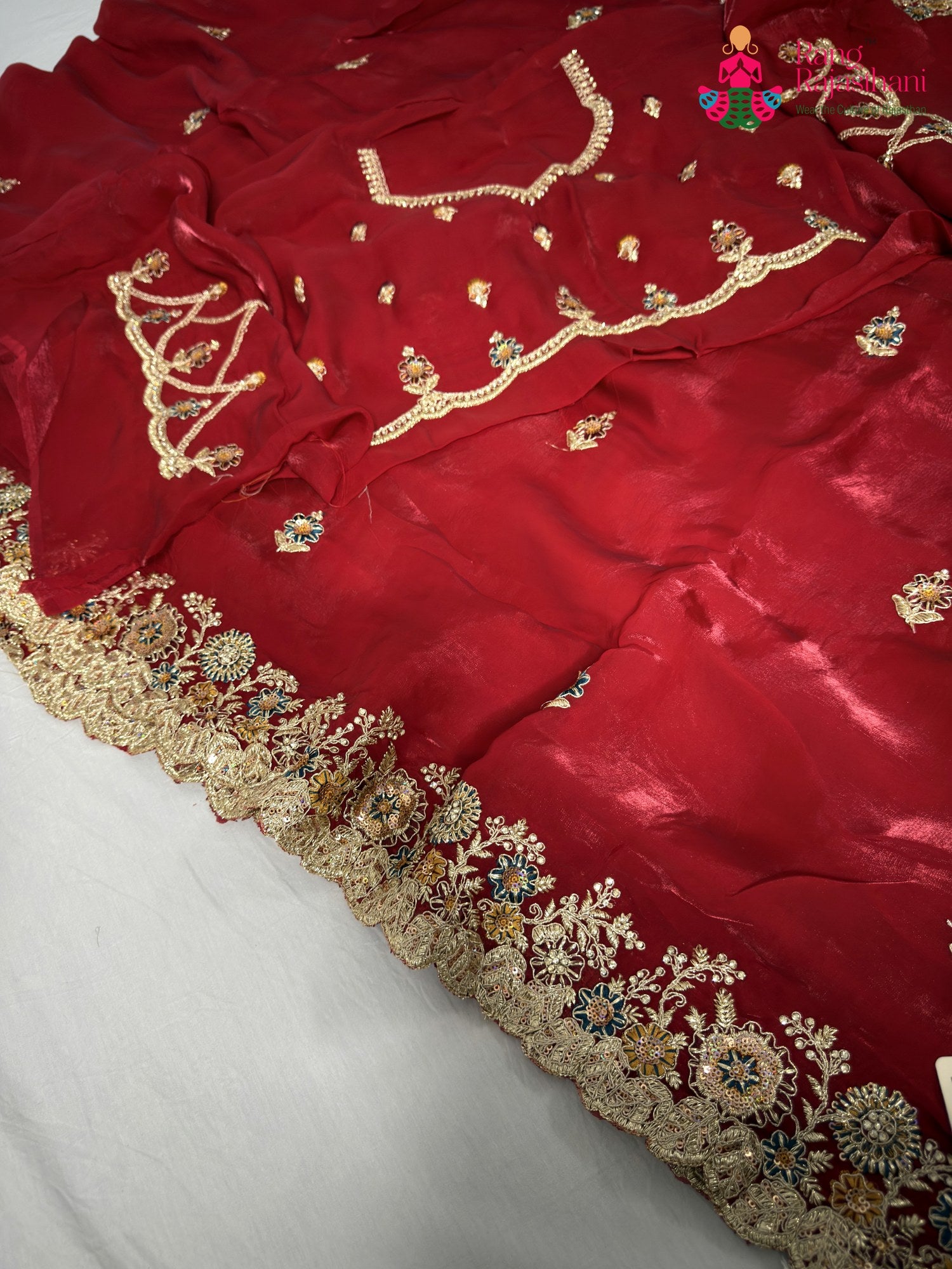 complete look of red synthetic zari embroidery saree