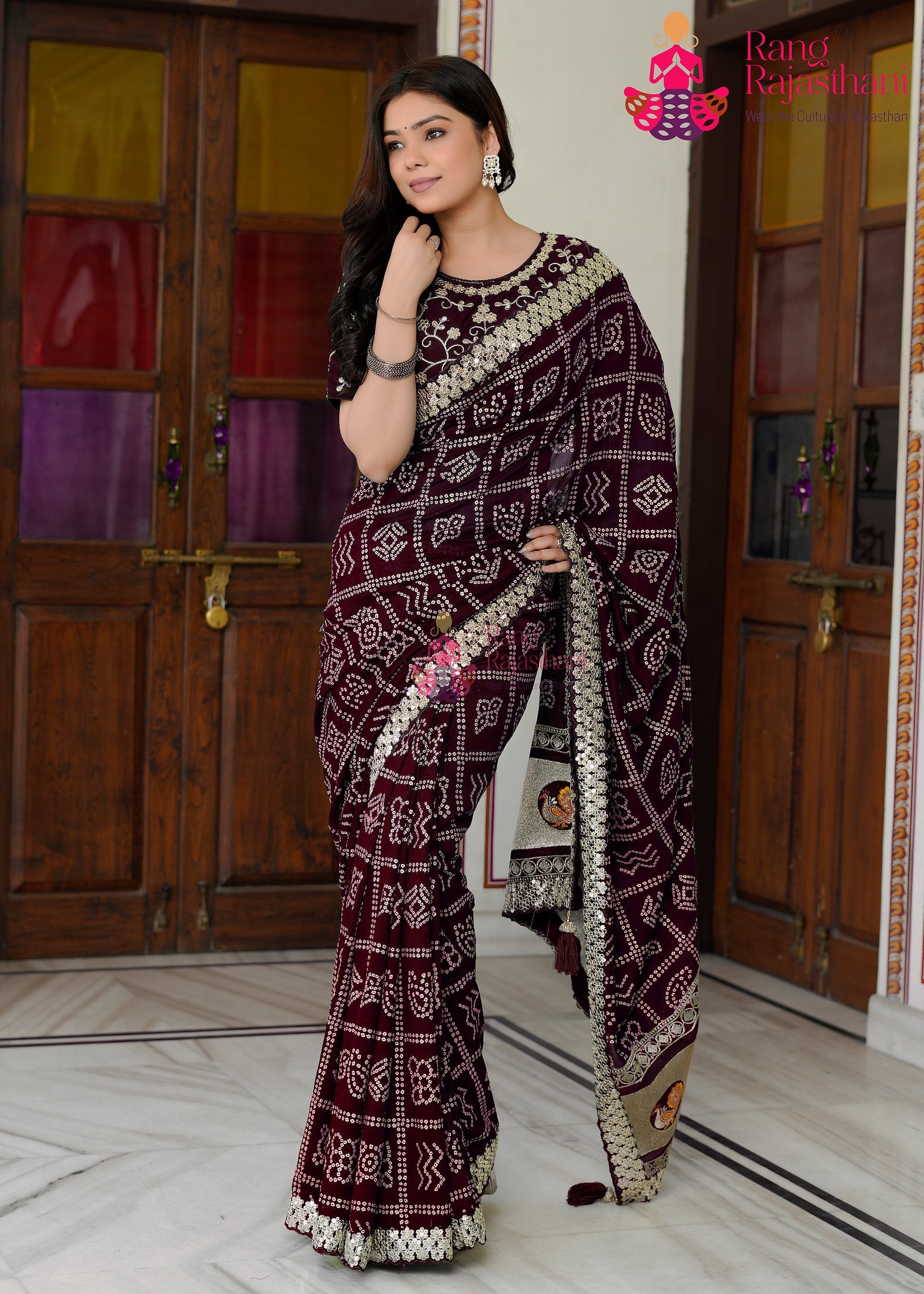 close up detailing of refined wine silk saree 