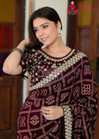 pallu detailing of refined wine silk saree 
