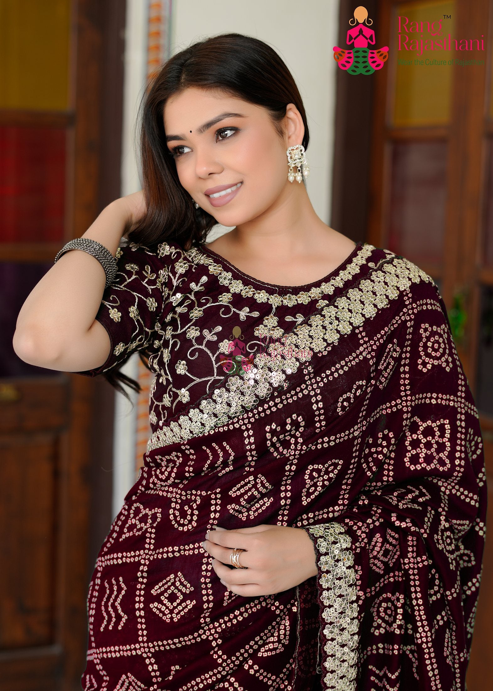 pallu detailing of refined wine silk saree 