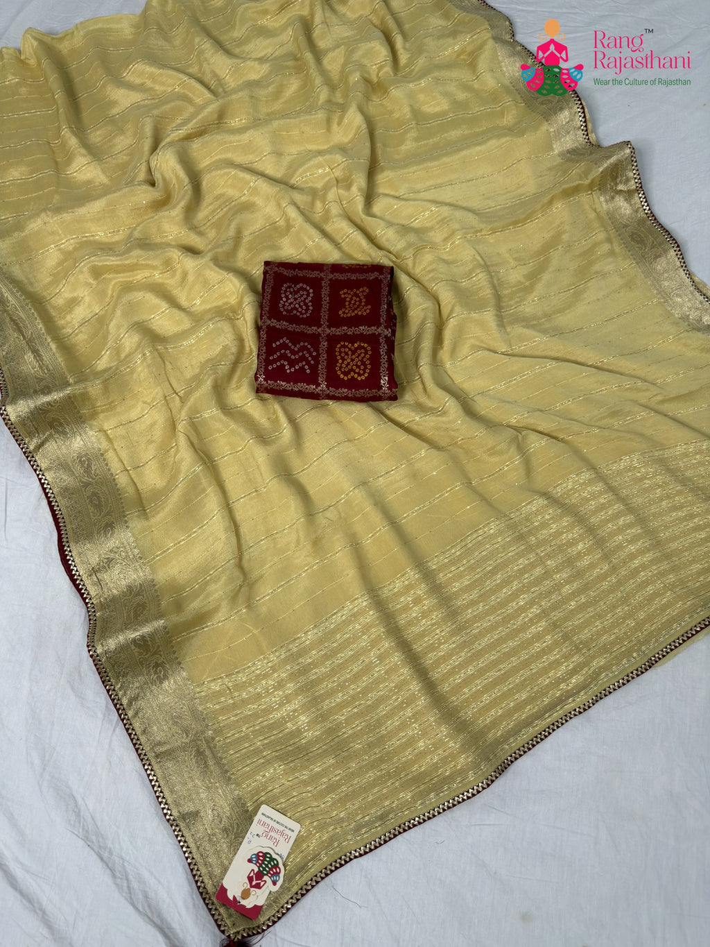 border detailing of soft cream fabric saree