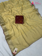 border detailing of soft cream fabric saree