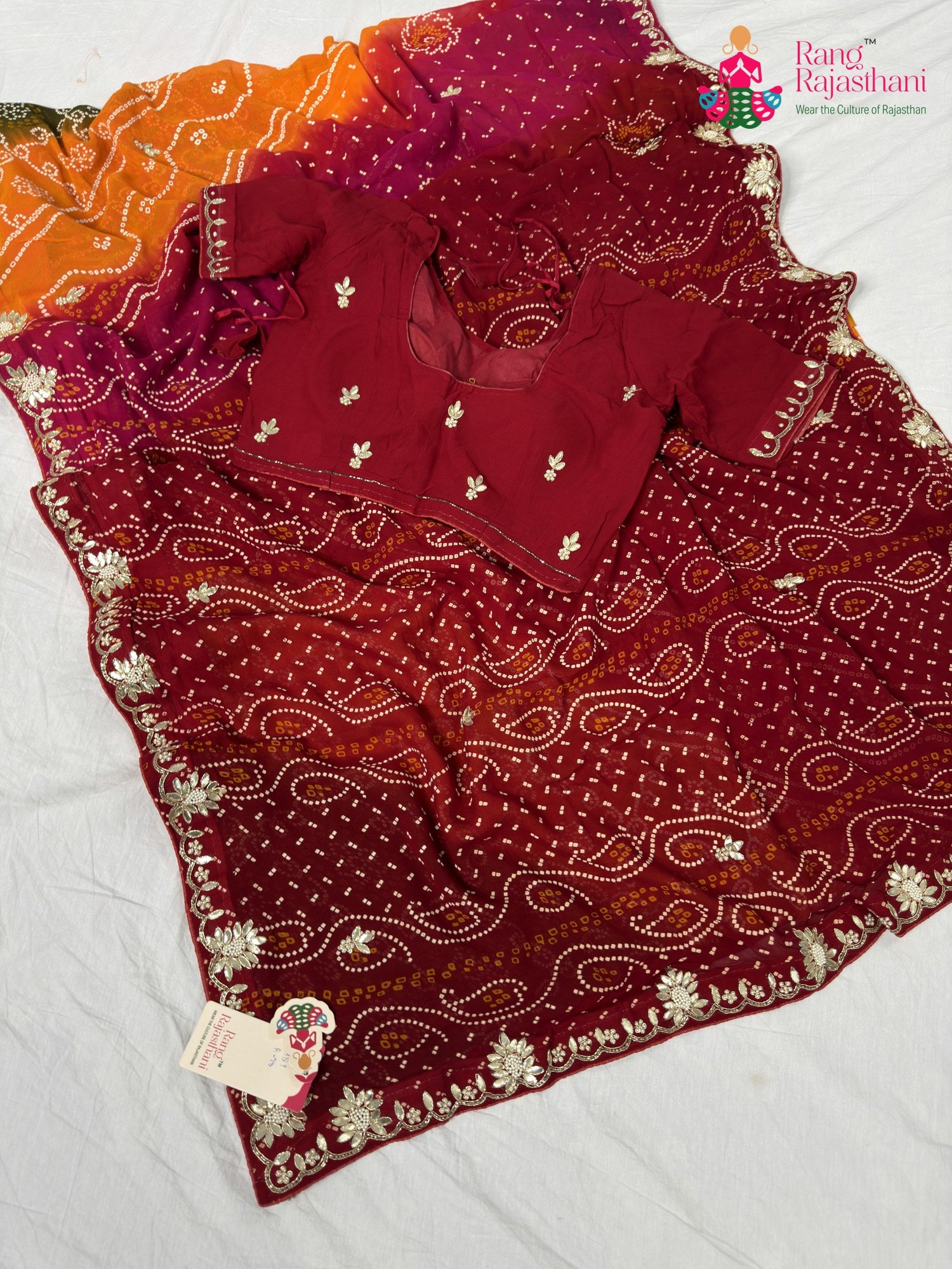 border detailing of soft red chundi saree