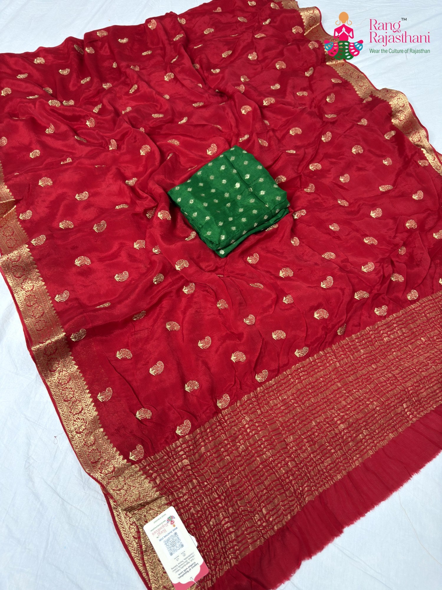 border detailing of soft red fabric saree