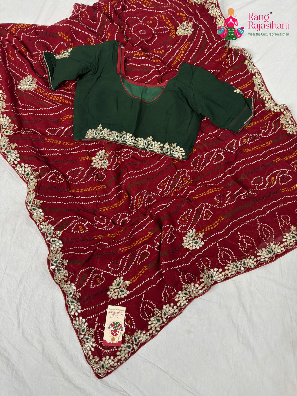 border detailing of soft red fabric saree