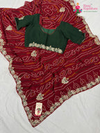 border detailing of soft red fabric saree
