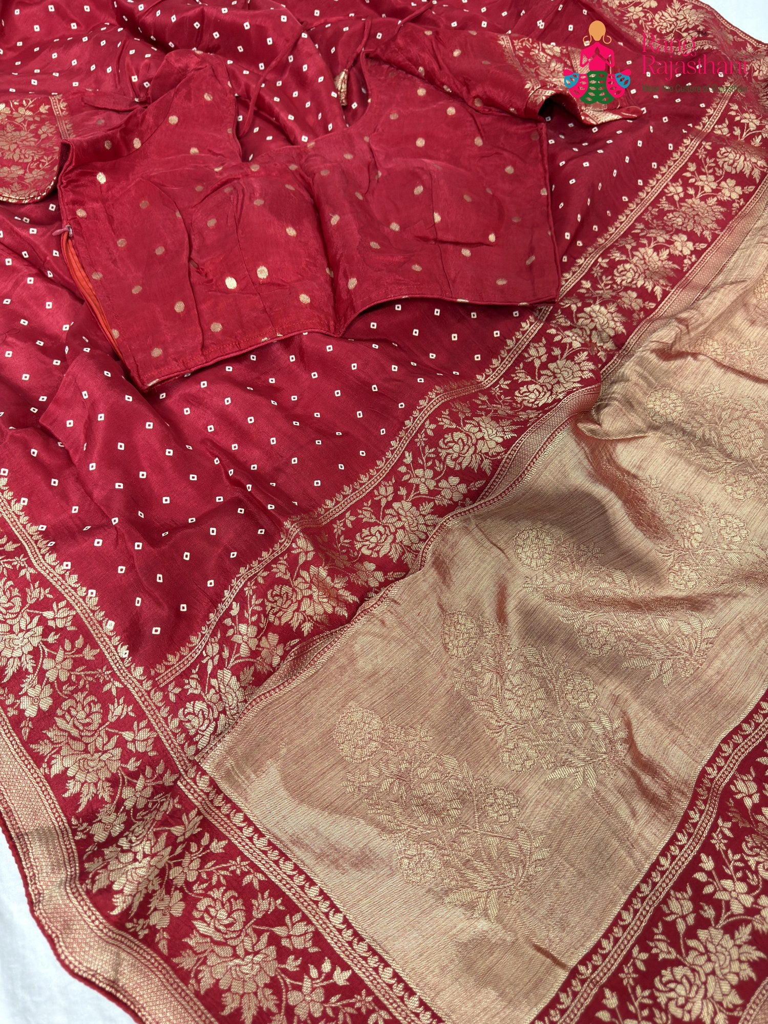 border detailing of soft red saree