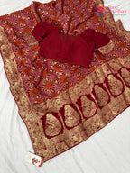 border detailing of soft red fabric saree