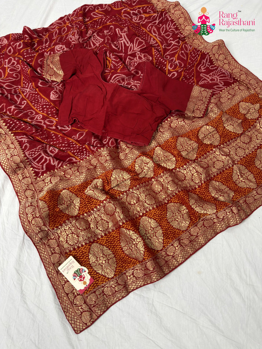 border detailing of soft red georgette saree