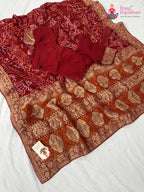 border detailing of soft red georgette saree