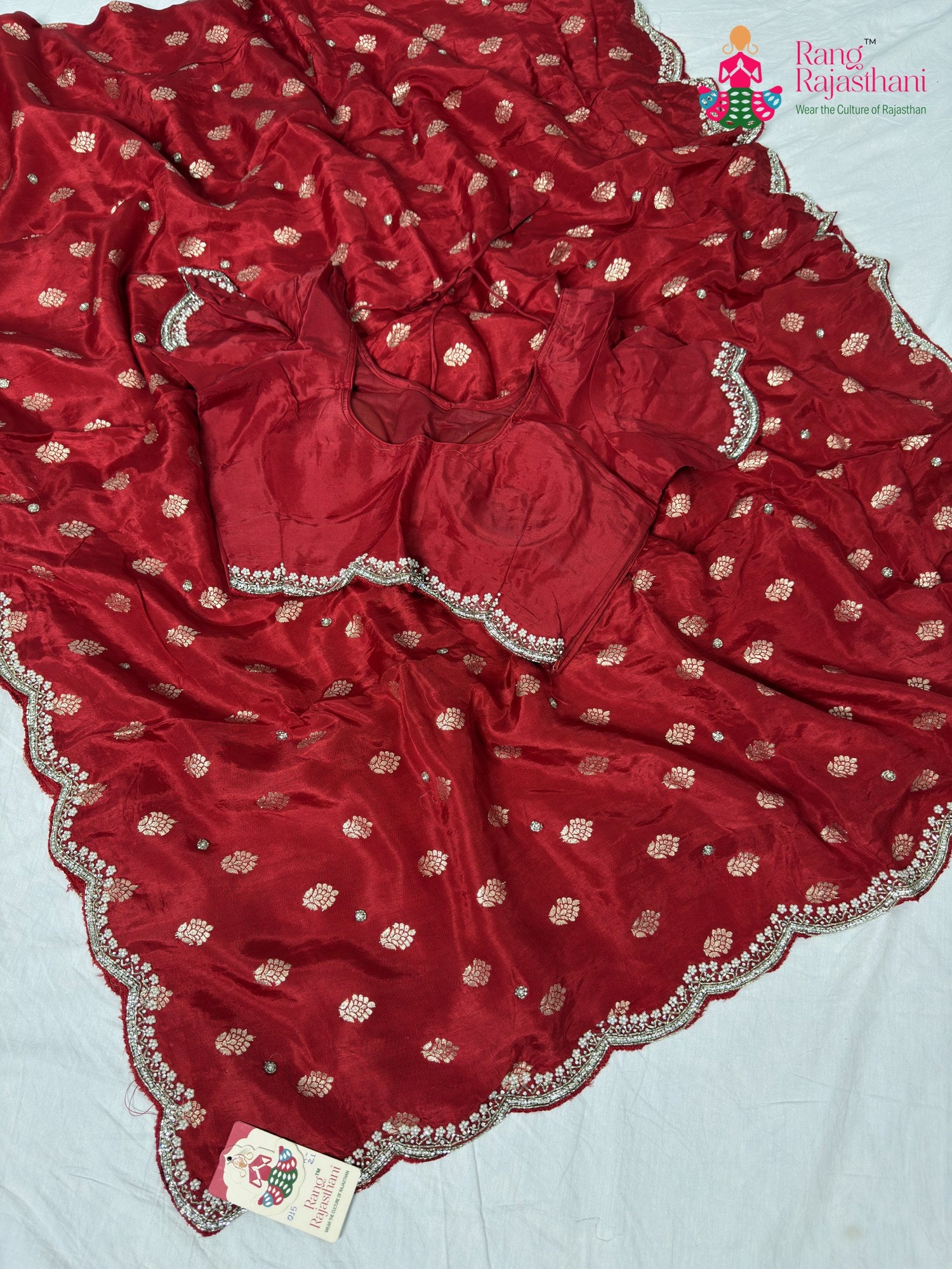 border detailing of soft red silk saree