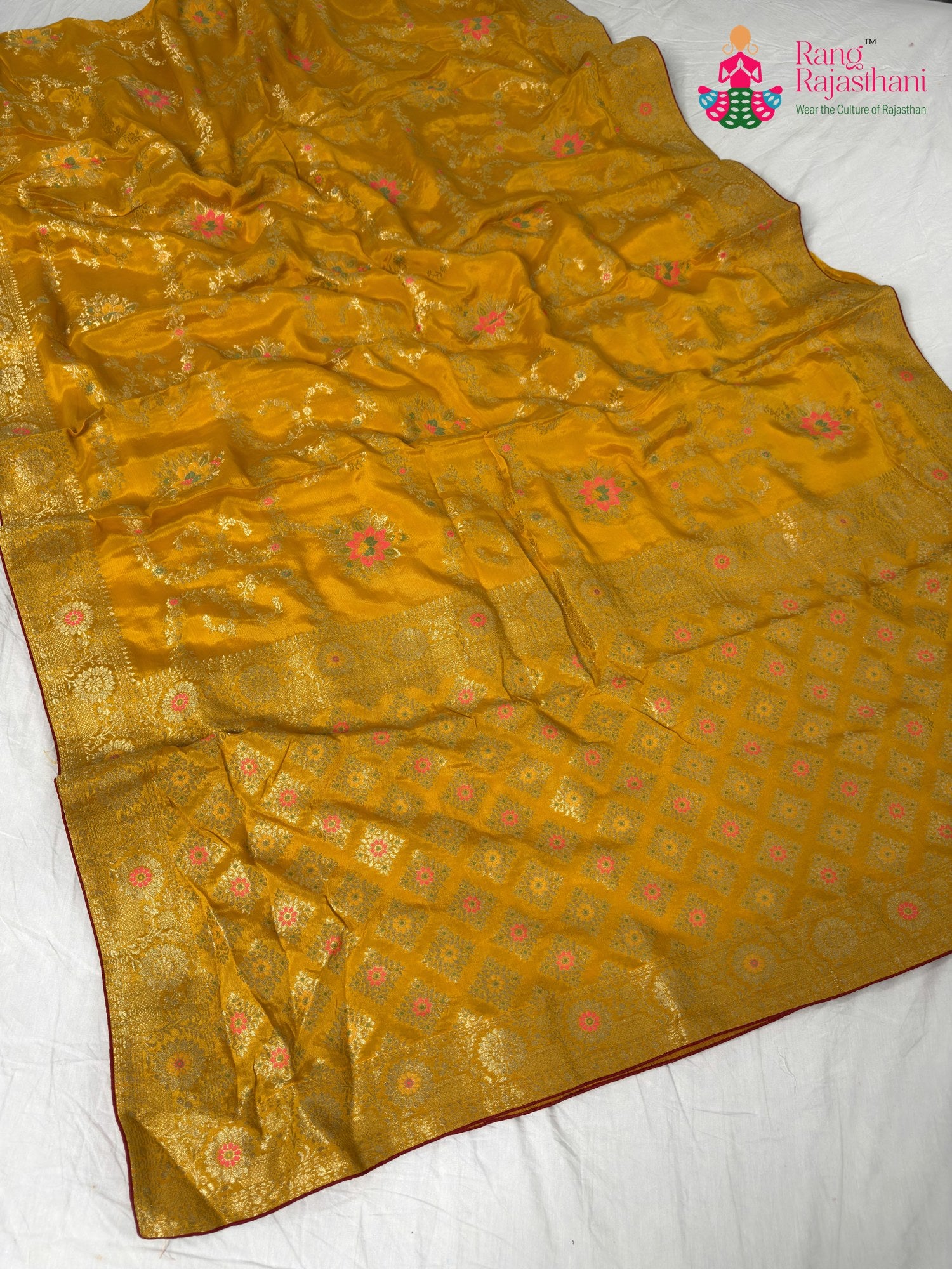 border detailing of sunlit yellow pure crape chinon banarasi khaddi mina jaal saree