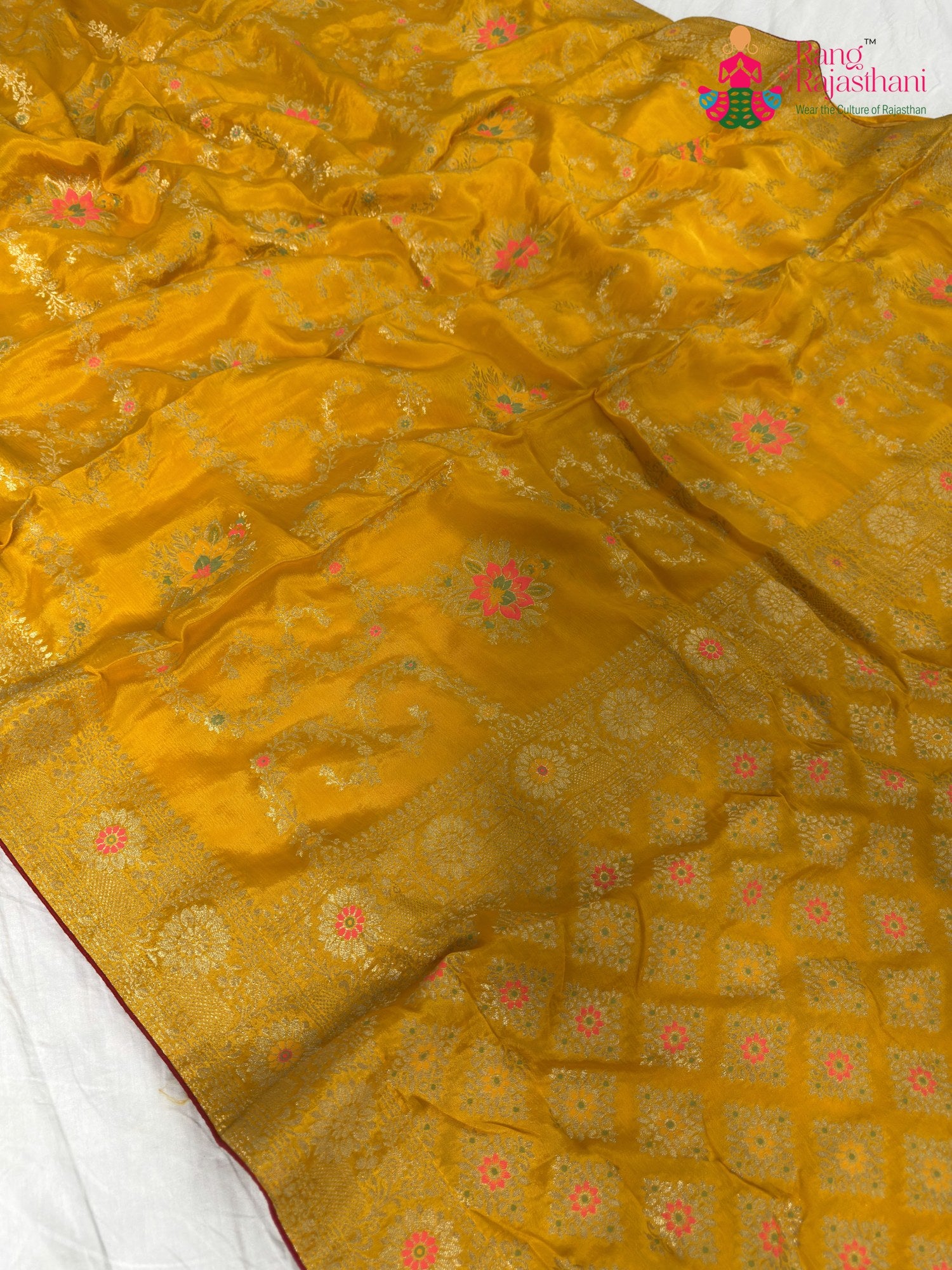 fabric texture of sunlit yellow pure crape chinon banarasi khaddi mina jaal saree