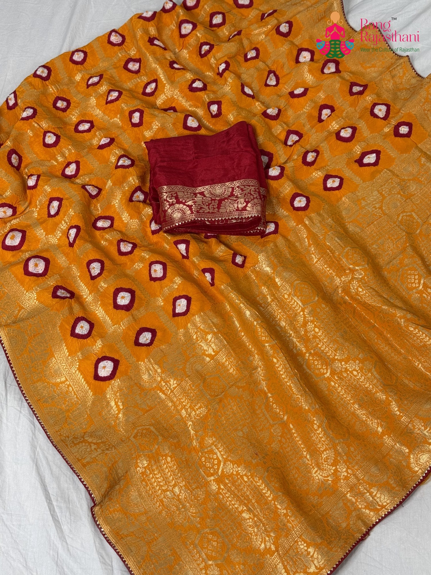 fabric texture of sunlit yellow pure dola silk bandhej banarasi zari saree