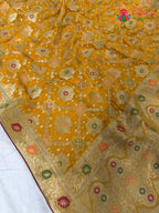 fabric texture of sunlit yellow pure georgette khaddi saree