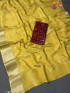 close up view of sunlit yellow pure kota silk banarasi zari border saree rajasthani grace