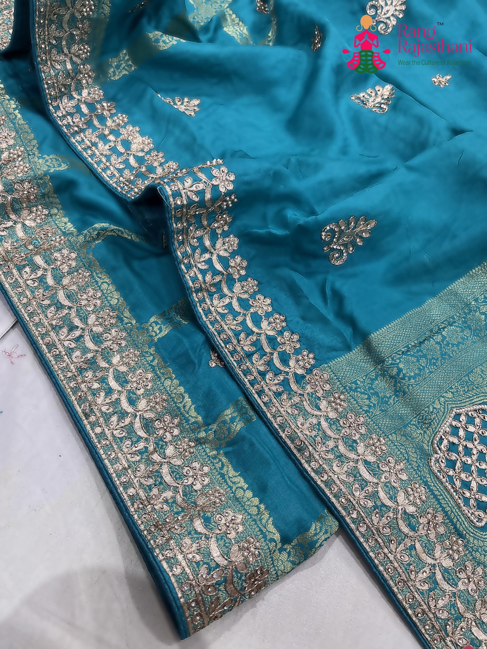 pallu detailing of teal art silk gotta patti saree 