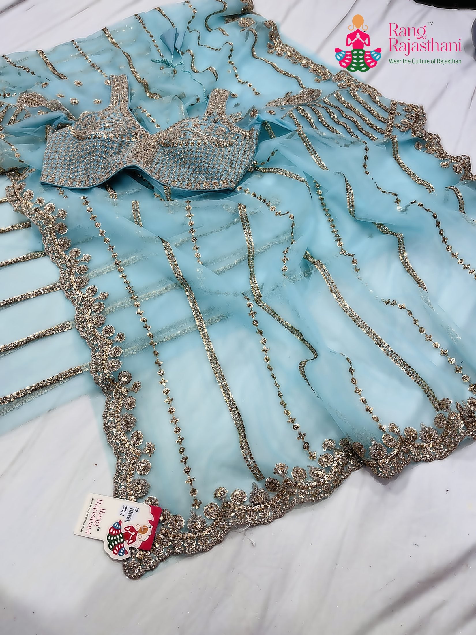 complete look of teal net sequin saree 