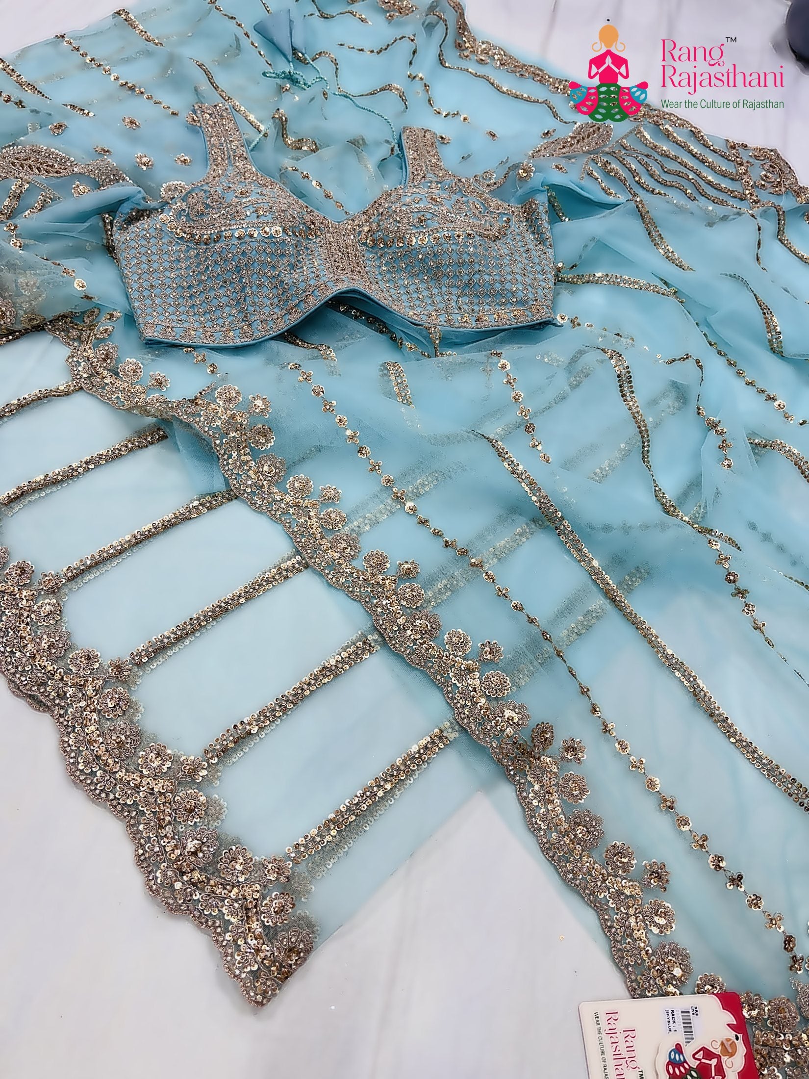 close up detailing of teal net sequin saree 