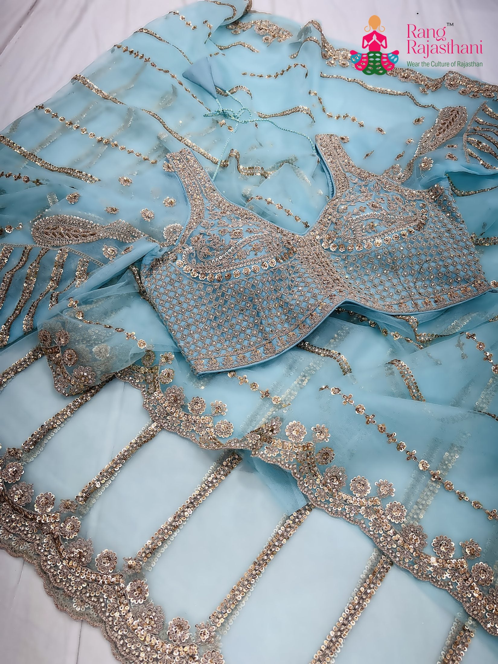teal net sequin saree  for wedding reception by Rang Rajasthani