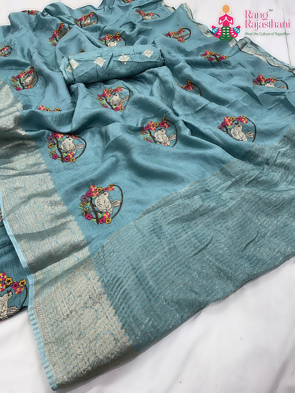 close up detailing of teal pure Russian silk resham embroidery saree 