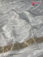 close up view of white pure ho silk meenakari saree