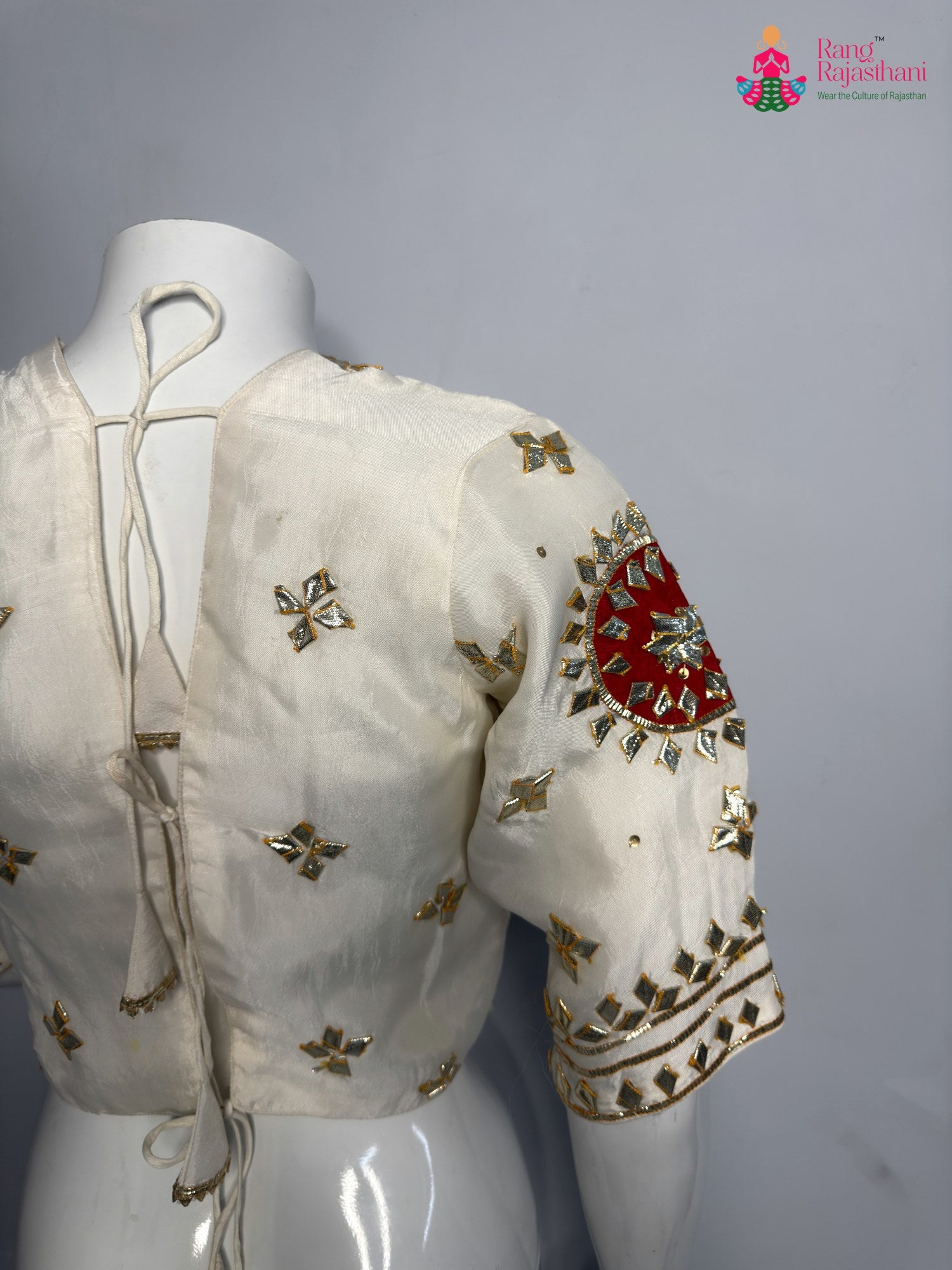 close up detailing of white pure upada silk gota patti blouse 3759