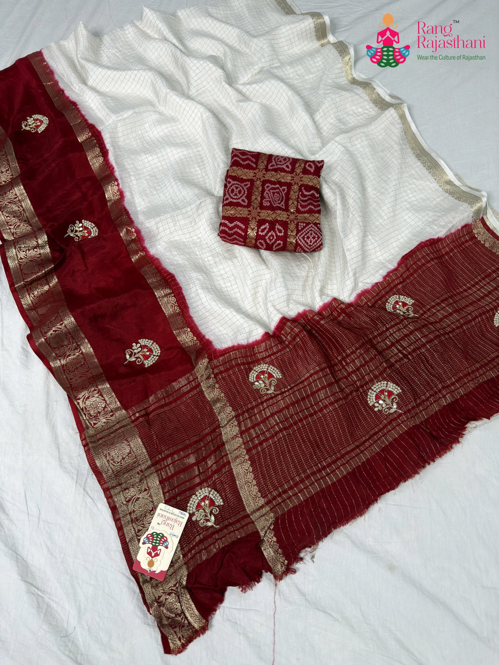 border detailing of white silk saree
