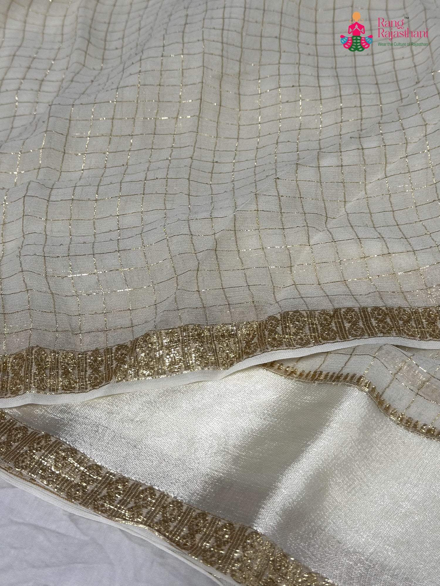 design pattern of white soft georgette banarasi zari weave saree