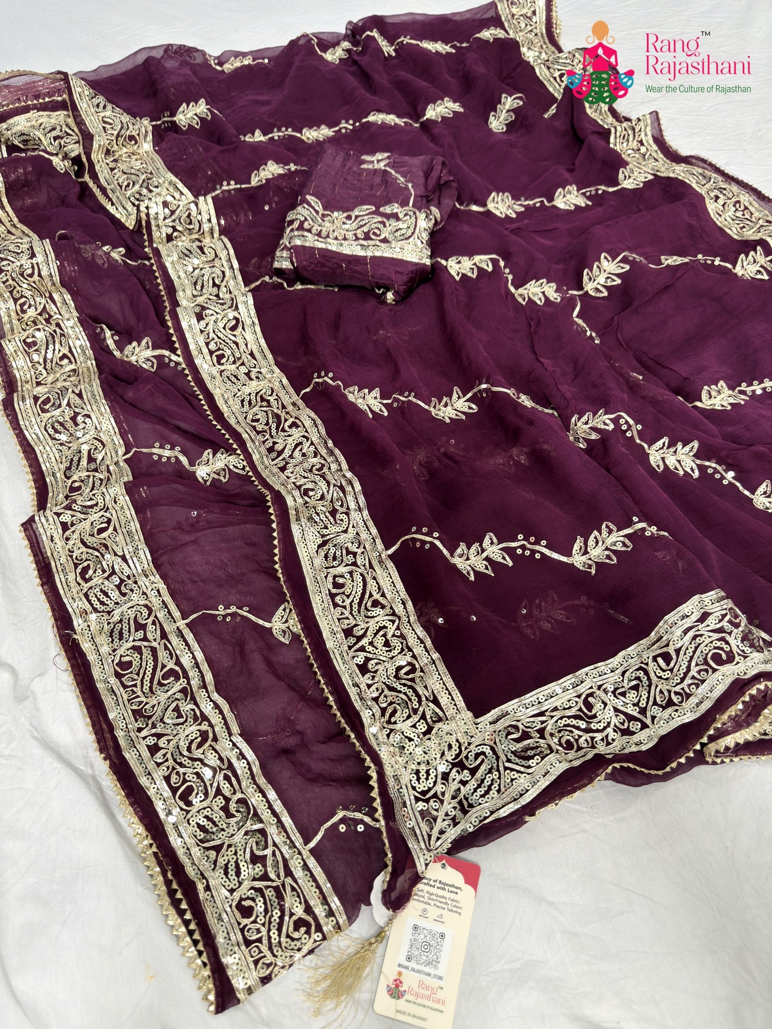 close up detailing of wine chiffon gota patti saree