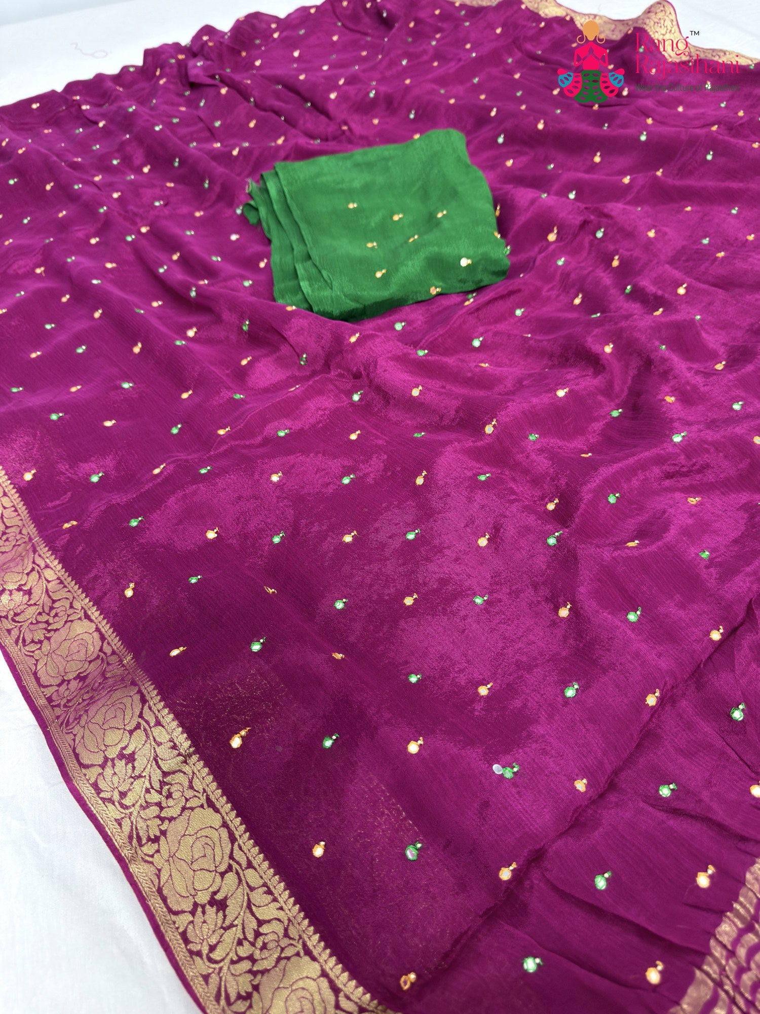 close up detailing of wine chinnon banarasi zari weave saree